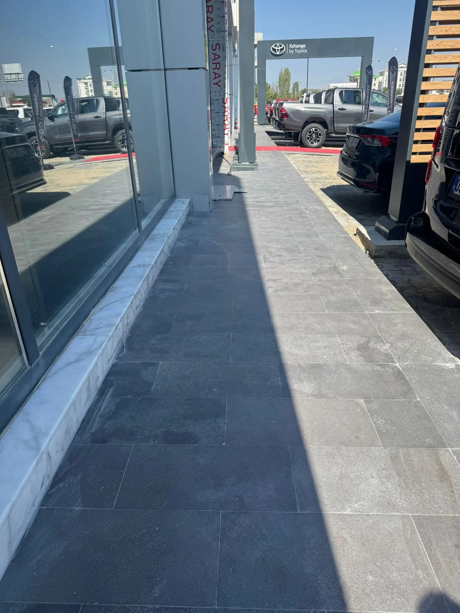 Dark basalt paving on an exterior walkway