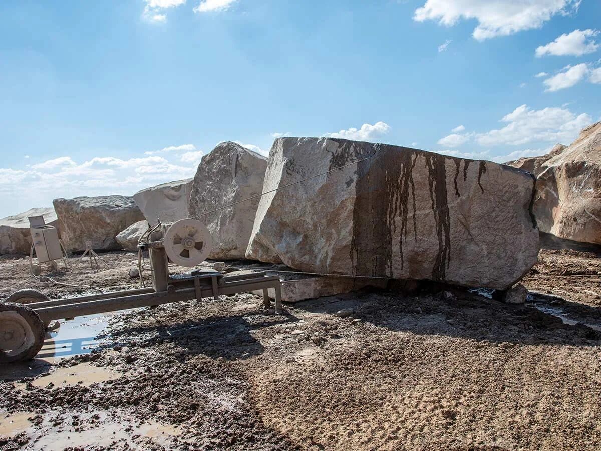 Wire-cutting a large stone block at the quarry